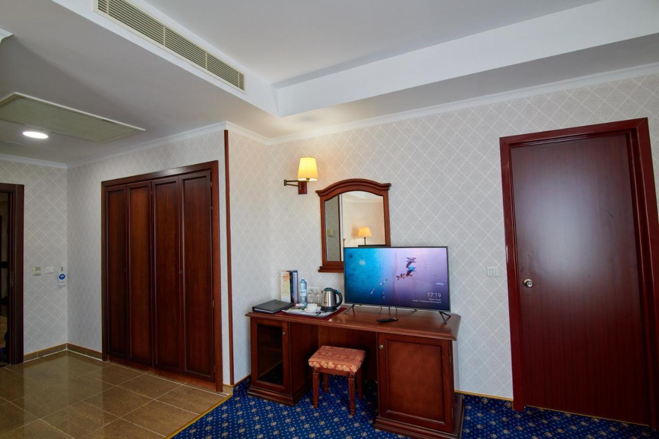 Grand Hotel Victory Aktau  Exteriör bild A room at the hotel
