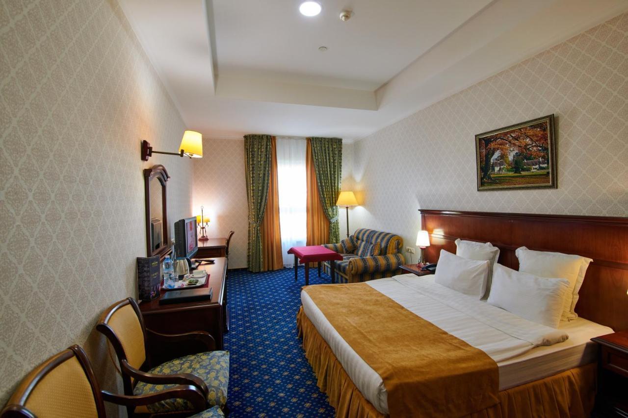 Grand Hotel Victory Aktau  Exteriör bild A room at the hotel
